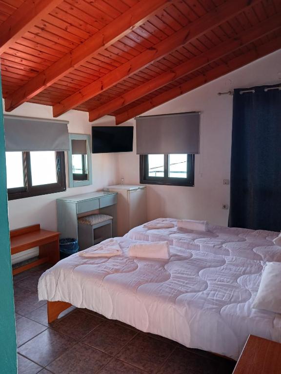 Postel nebo postele na pokoji v ubytování Soulis Hotel