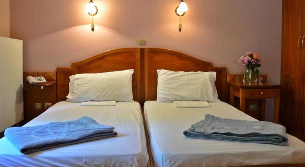 Postel nebo postele na pokoji v ubytování Archontiko tou Ziaka