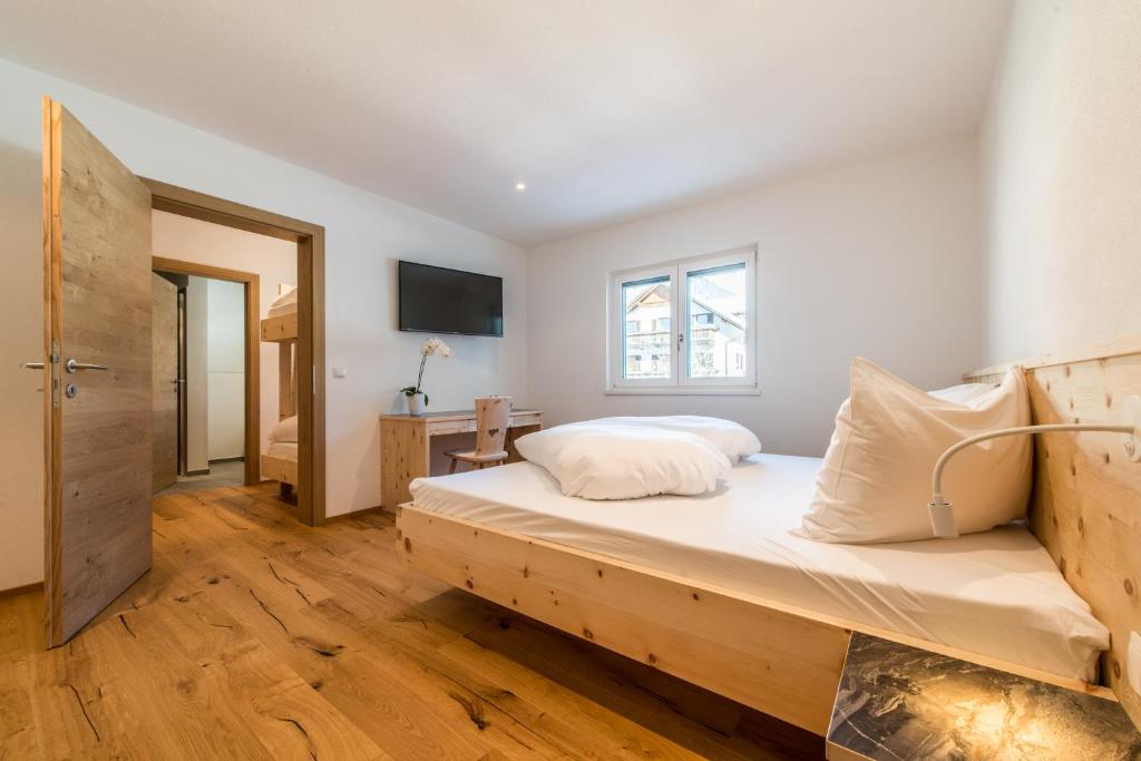 Postel nebo postele na pokoji v ubytování Hotel Antholzerhof