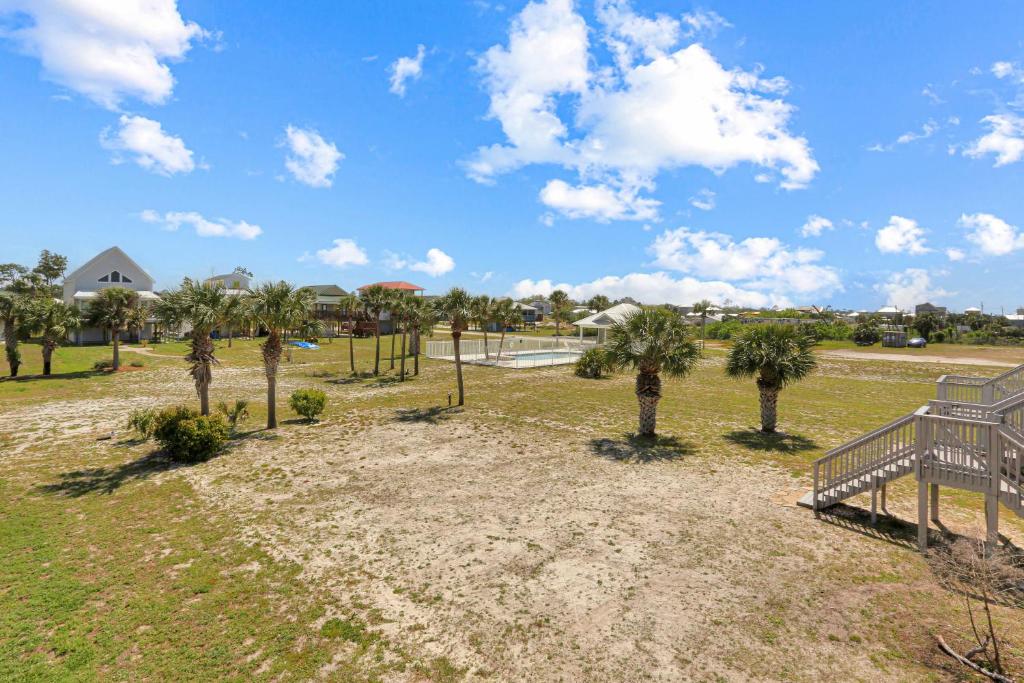 a park with palm trees and a playground at The Shore House by Pristine Properties Vacation Rentals in Saint Joe Beach