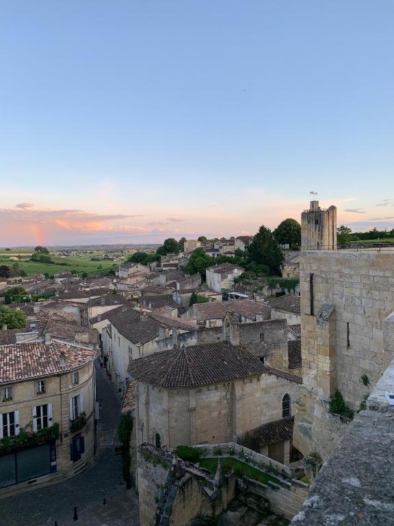 an aerial view of a city with buildings and a tower at La Maison du Clocher in Saint-Émilion