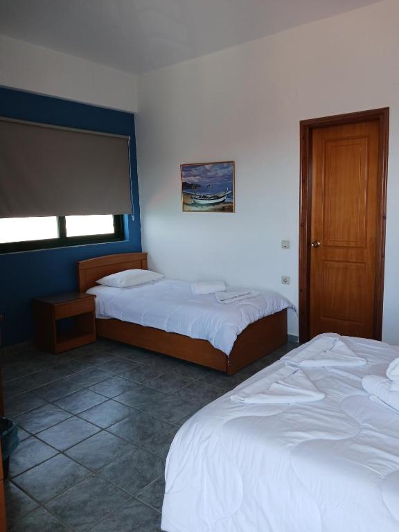Postel nebo postele na pokoji v ubytování Soulis Hotel