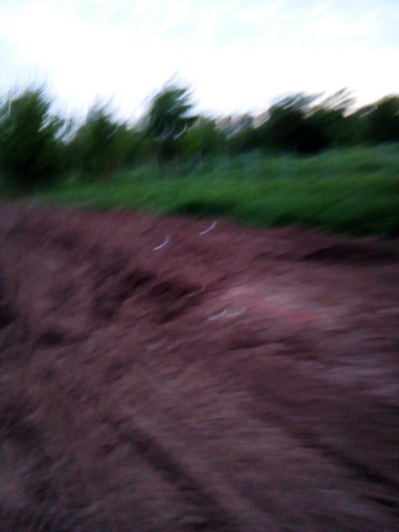 a blurry picture of a dirt road with grass at Geräumiges Haus für Familien Koppl in Habach