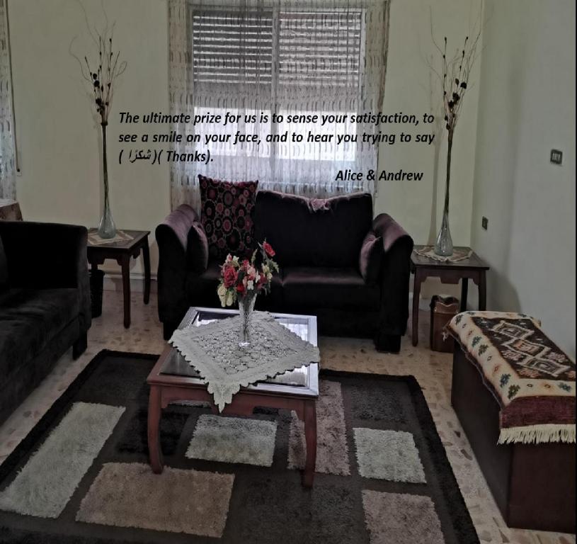 a living room with a couch and a coffee table at Alice & Andrew Apt. Few Steps to Madaba Old City Center in Madaba