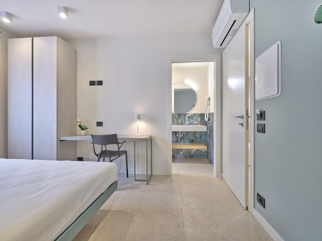 Postel nebo postele na pokoji v ubytování Piccolo Hotel