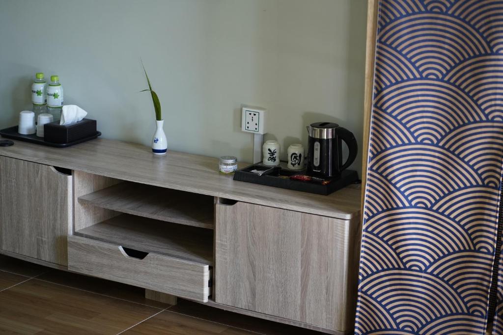 a room with a wooden desk with a wall at WHITE SAND ARK RESORT in Koh Rong Island