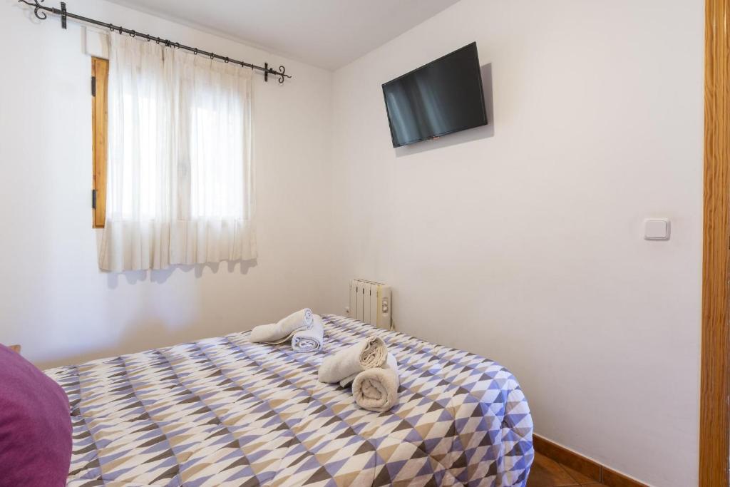 Postel nebo postele na pokoji v ubytování Carrebaix I