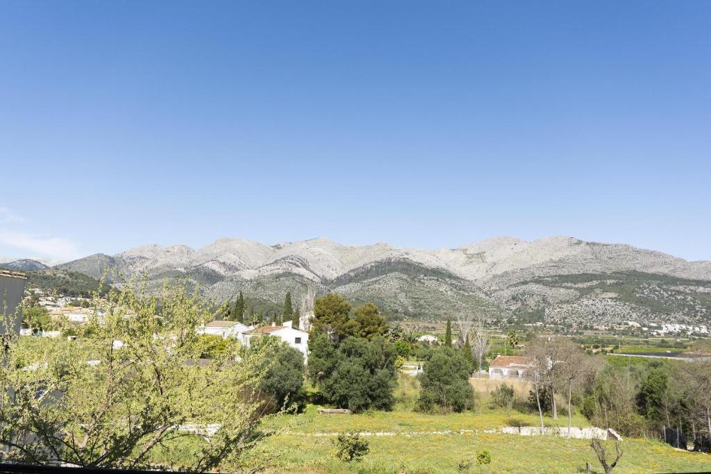 a view of a town with mountains in the background at Carrebaix IV in Orba