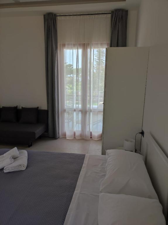 Postel nebo postele na pokoji v ubytování Villa Rita Apartament & Rooms