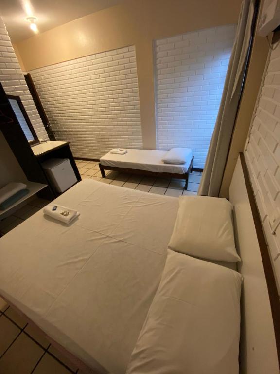 Cama ou camas em um quarto em Hotel D'Luz