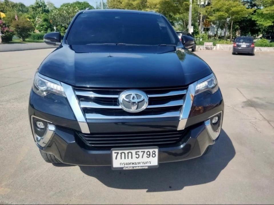 a blue toyota fortuner parked in a parking lot at Ladies driver 