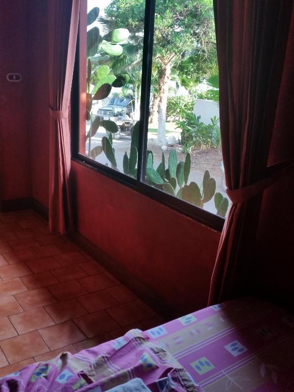 Postel nebo postele na pokoji v ubytování Hotel Cabinas Mar Y Cielo
