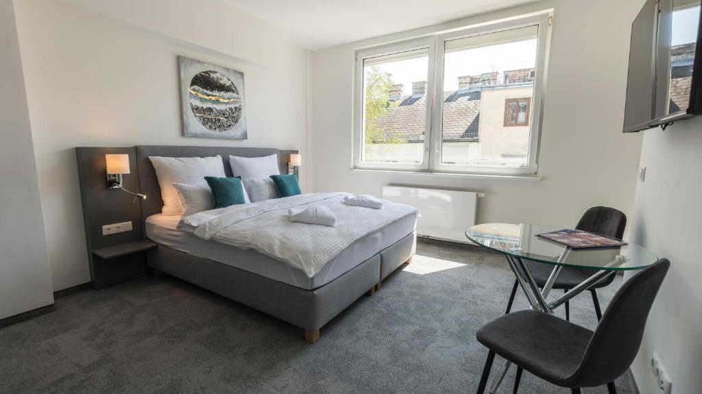 Postel nebo postele na pokoji v ubytování Vienna Cube Apartments Contactless Check IN