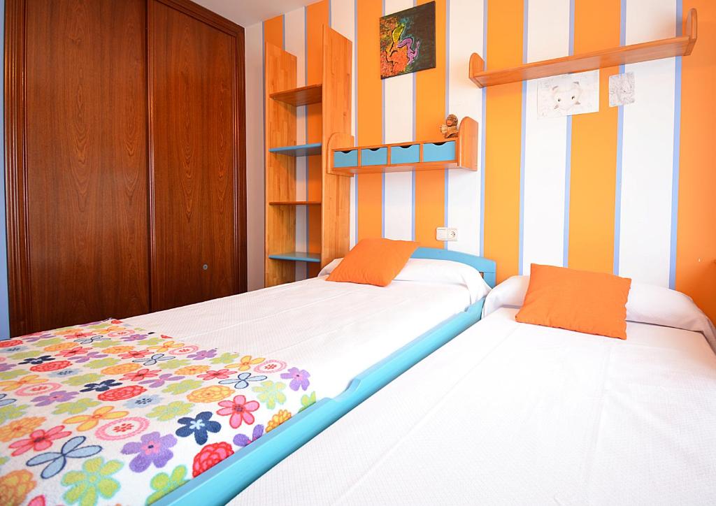Postel nebo postele na pokoji v ubytování Apartamento próximo a la Playa de A Lanzada