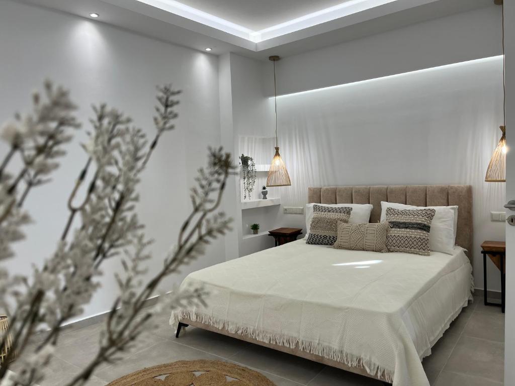 Säng eller sängar i ett rum på Aleria Central Apartments