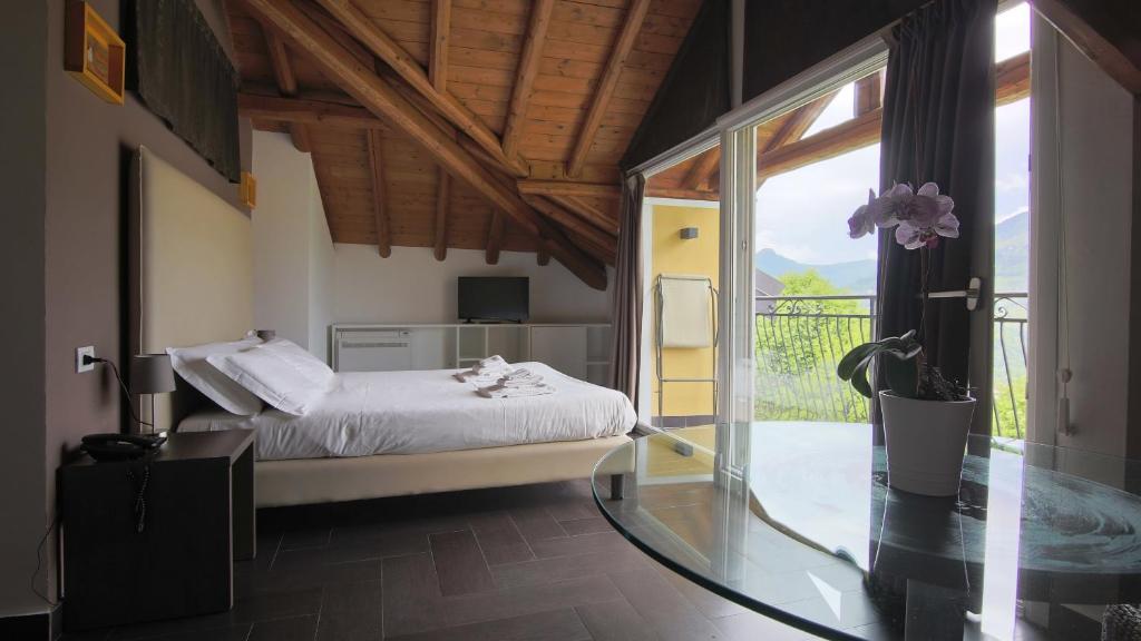 Postel nebo postele na pokoji v ubytování Hotel Corte Santa Libera