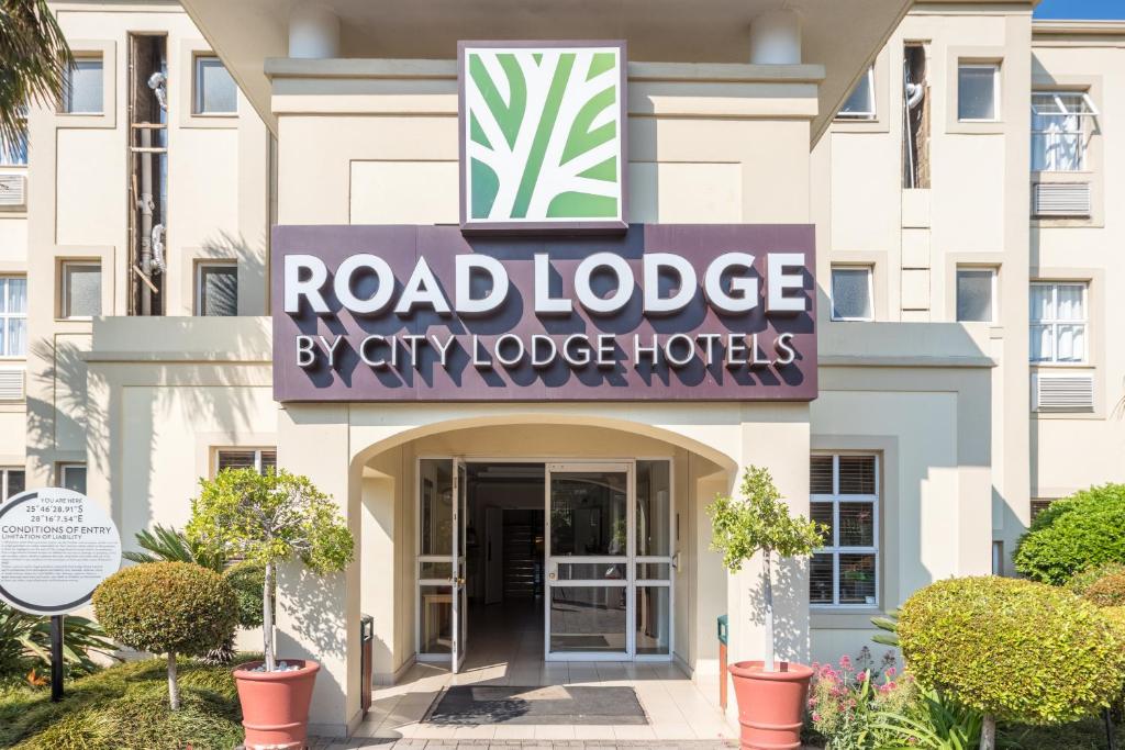 a building with a sign for a hotel at Road Lodge Isando in Germiston