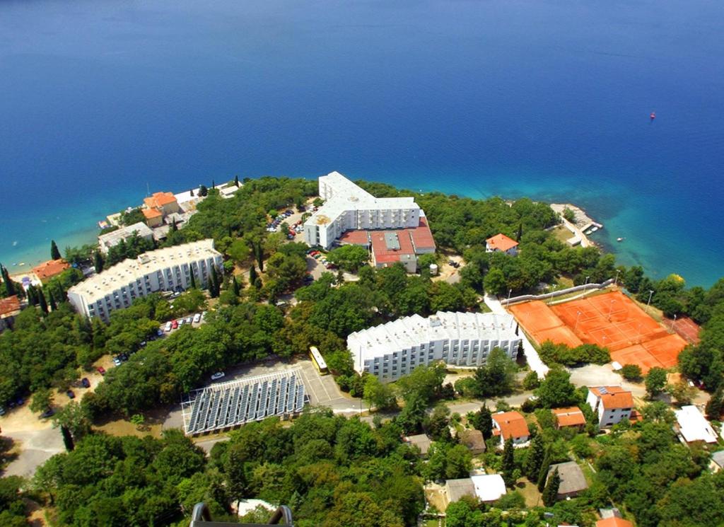 an aerial view of a building on an island at Depadansa Marina & Primorka in Omišalj