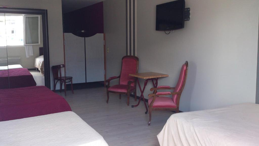 Postel nebo postele na pokoji v ubytování Hotel Moderne