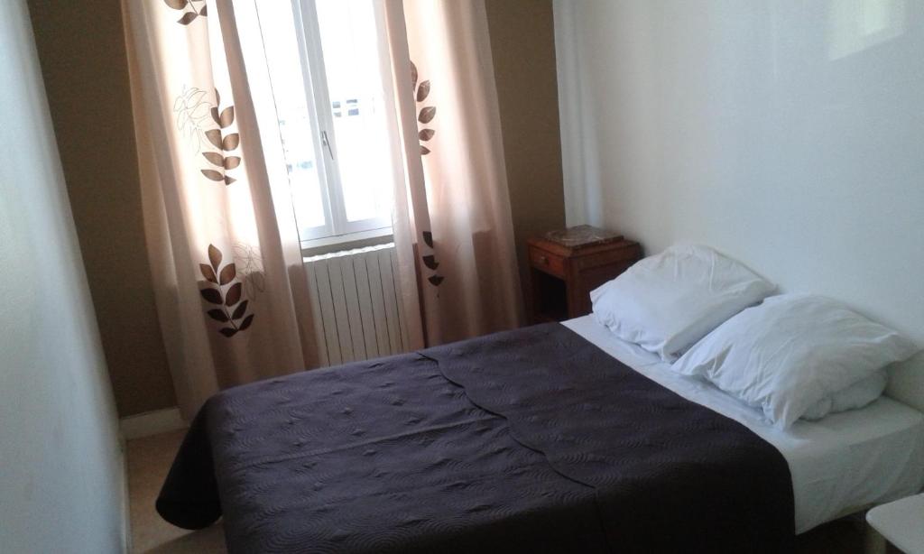 Postel nebo postele na pokoji v ubytování Hotel Moderne