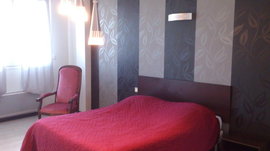 Postel nebo postele na pokoji v ubytování Hotel Moderne
