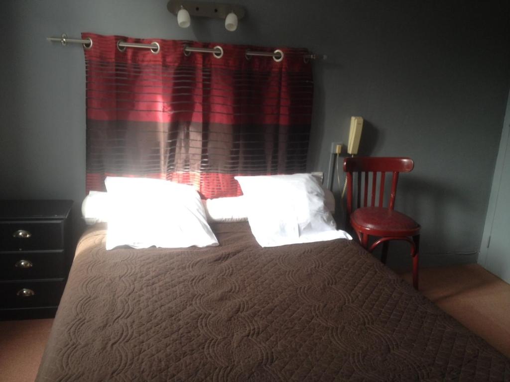 Postel nebo postele na pokoji v ubytování Hotel Moderne