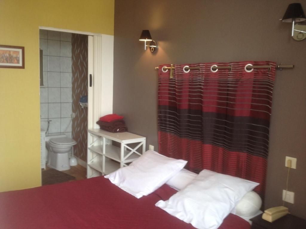 Postel nebo postele na pokoji v ubytování Hotel Moderne
