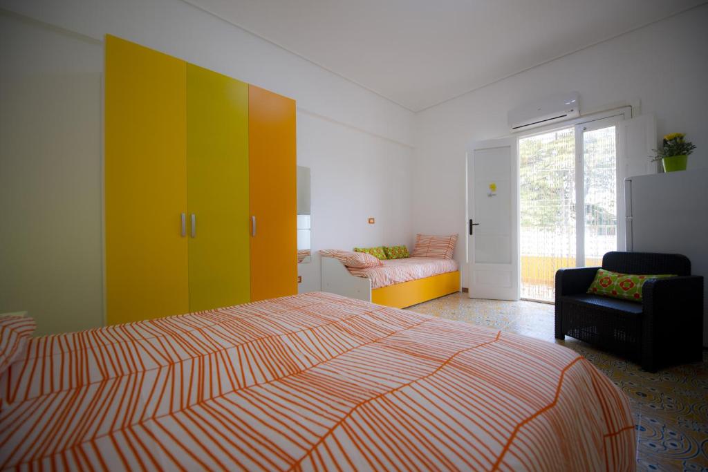 Postel nebo postele na pokoji v ubytování B&B Fiori Gialli Caucana