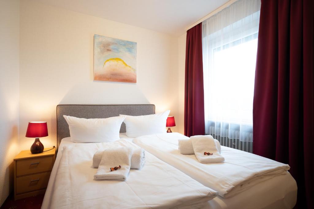 Postel nebo postele na pokoji v ubytování Hotel Zum Prinzen Sinsheim