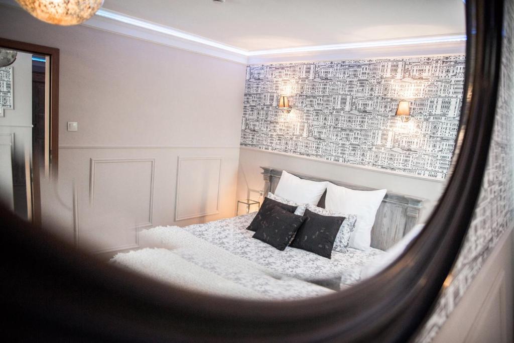 Postel nebo postele na pokoji v ubytování Hotel Wodnik
