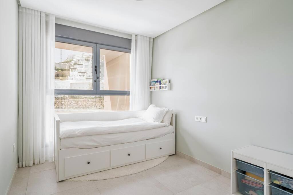 Łóżko lub łóżka w pokoju w obiekcie Casa Marbella