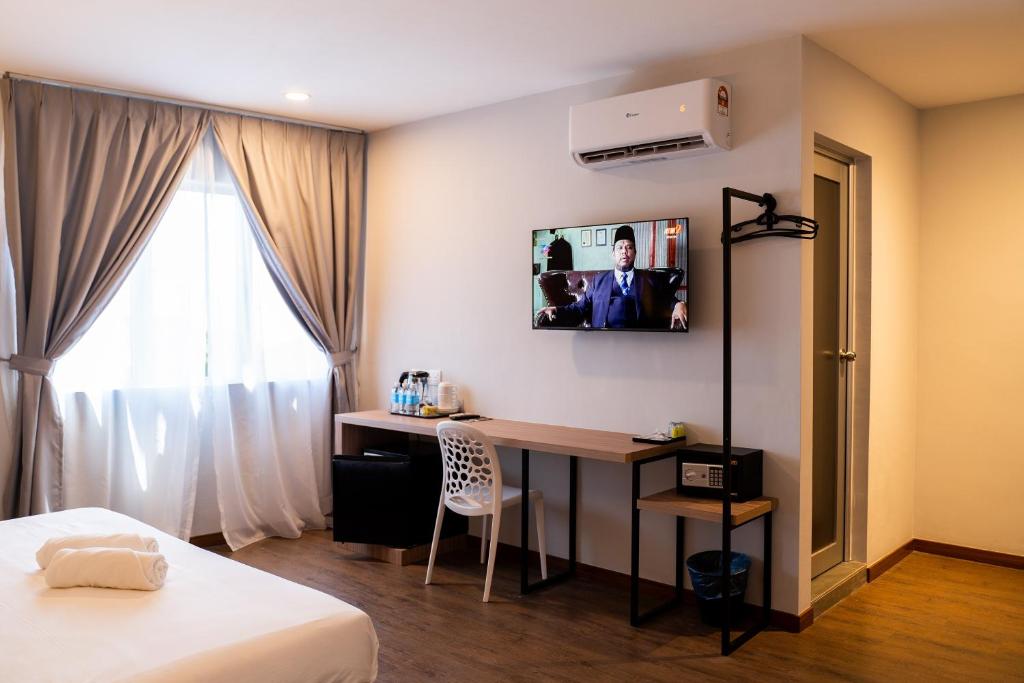 TV a/nebo společenská místnost v ubytování RM Hotel Muar