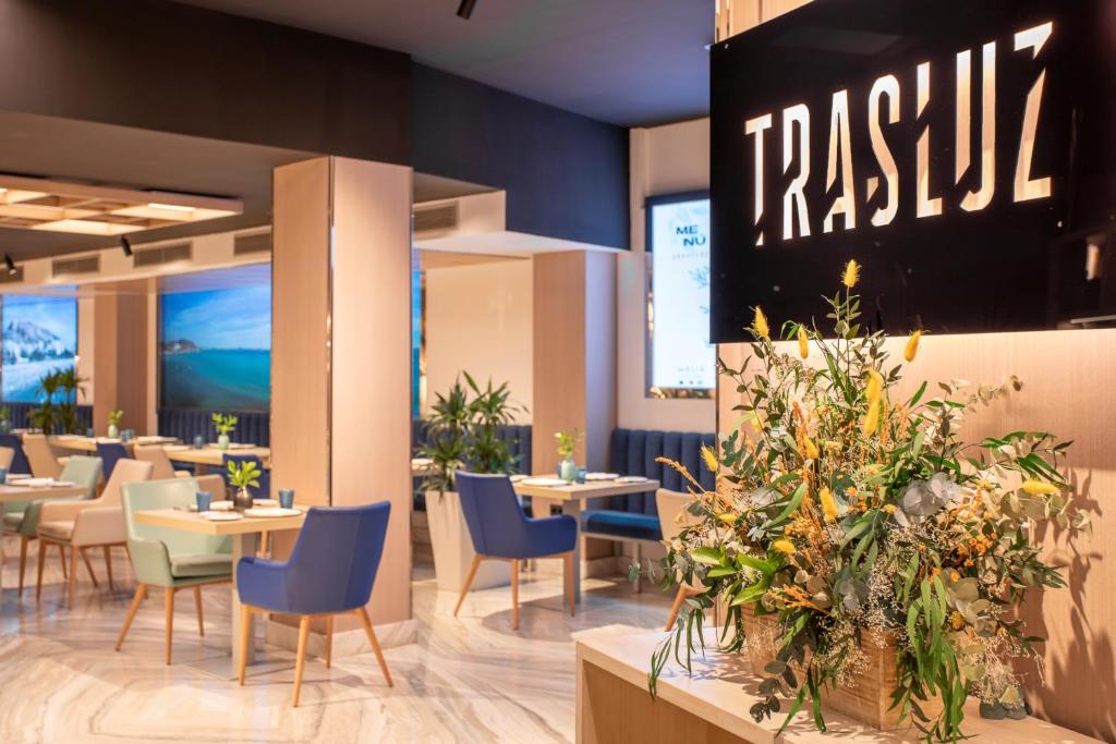 a restaurant with tables and chairs and a sign that reads pasta at Melia Alicante in Alicante
