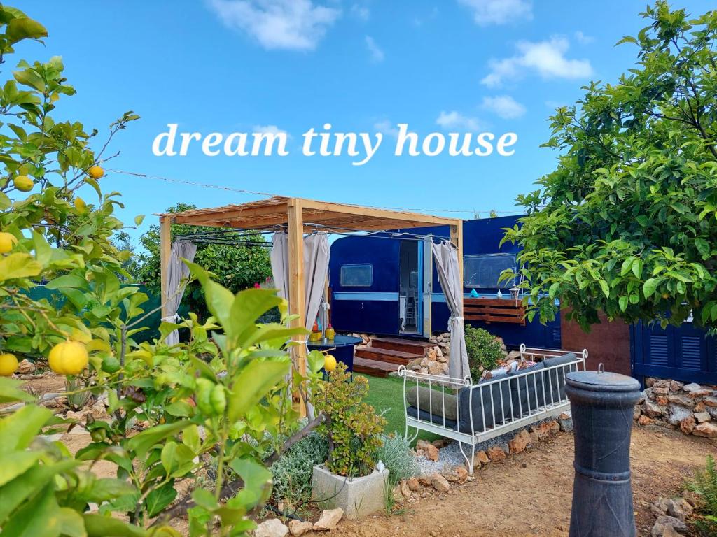 a dream tiny house in a garden with the words dream tiny house at Dream Tiny House or Luxus Tent with pool in Chania