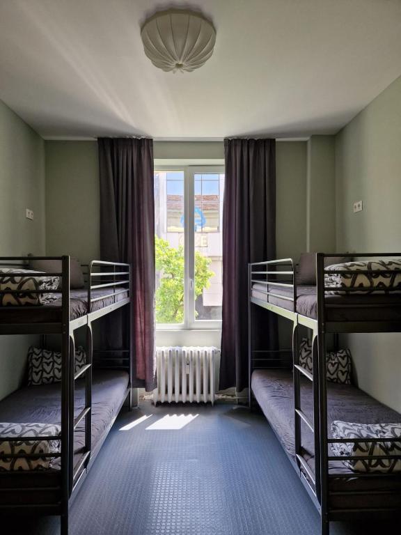 Postel nebo postele na pokoji v ubytování Bla Bla Hostel