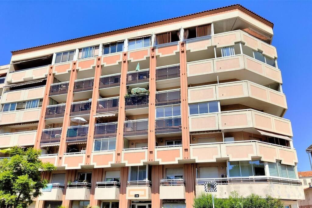 an apartment building with balconies on the side of it at Appartement 2 pièces de 29 m2 in Cannes