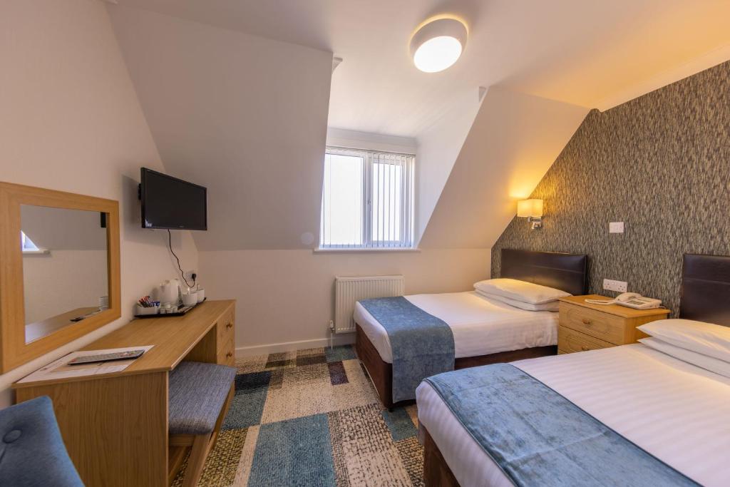 TV a/nebo společenská místnost v ubytování Pandora Hotel