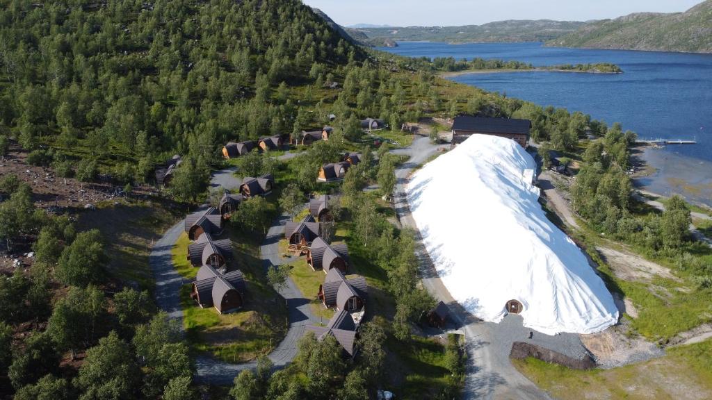 an aerial view of a large building next to a lake at Snowhotel Kirkenes in Kirkenes