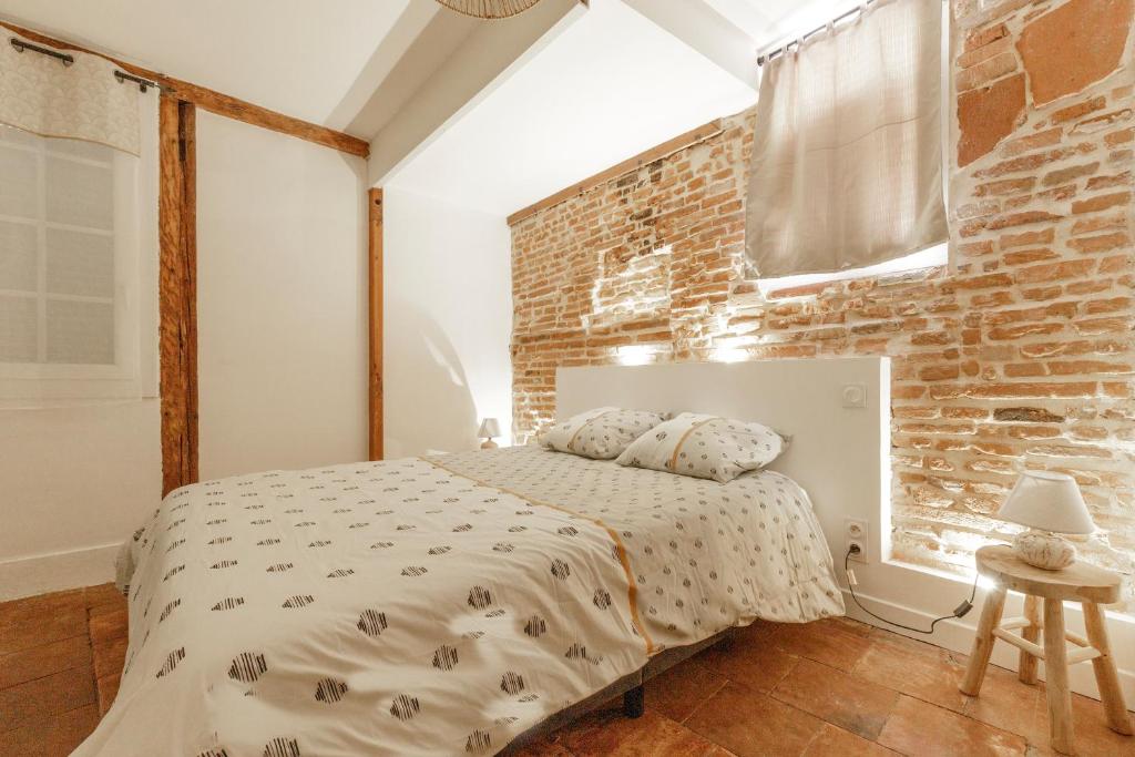Ένα ή περισσότερα κρεβάτια σε δωμάτιο στο Elégant T2 avec balnéo à 100m du Capitole
