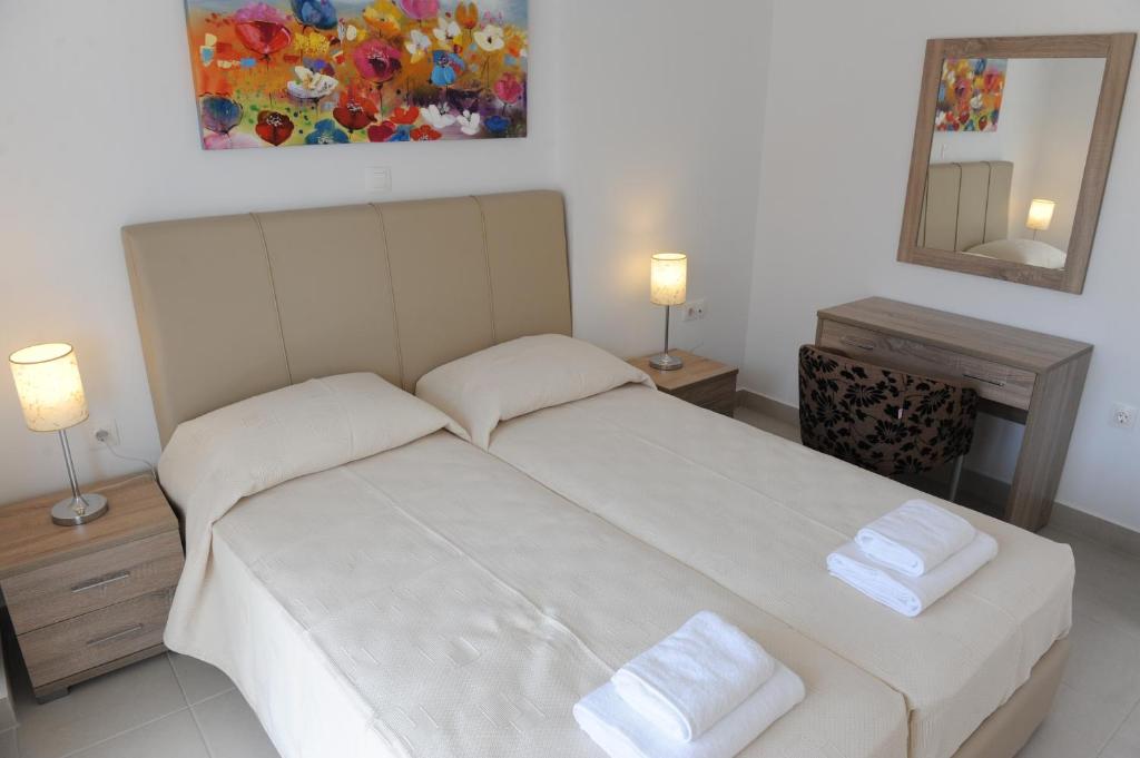 Postel nebo postele na pokoji v ubytování Gennadi Aegean Horizon Villas