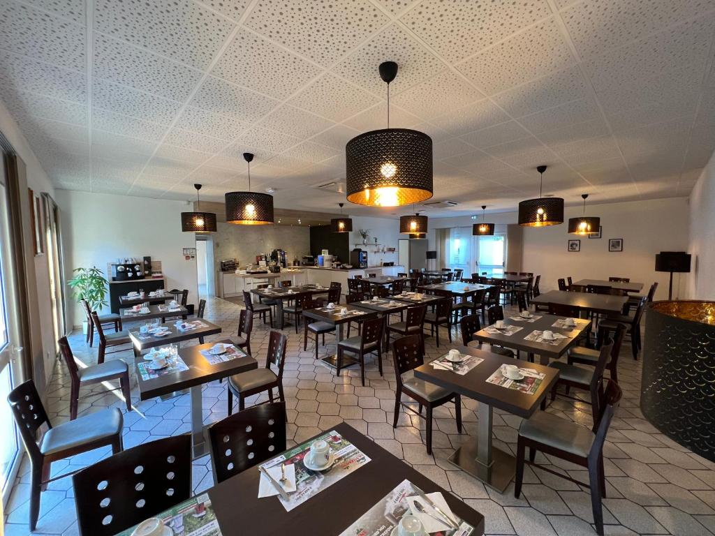 Restaurace v ubytování Les Orchidées , Hôtel & Restaurant