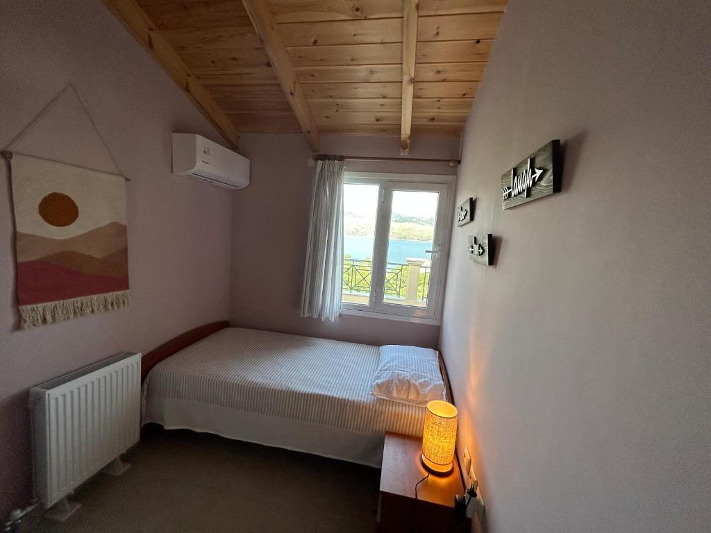 Postel nebo postele na pokoji v ubytování Emelia Apartment