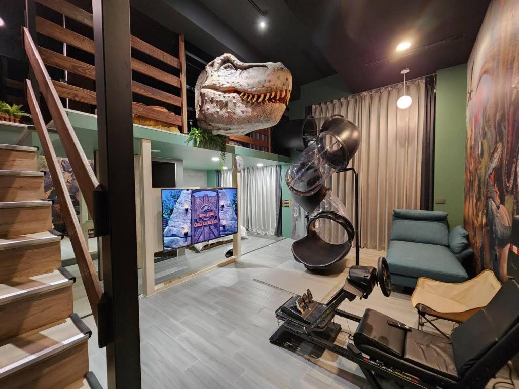 a living room with a dinosaur head on the wall at 宜蘭哥德白色城堡民宿 in Wujie