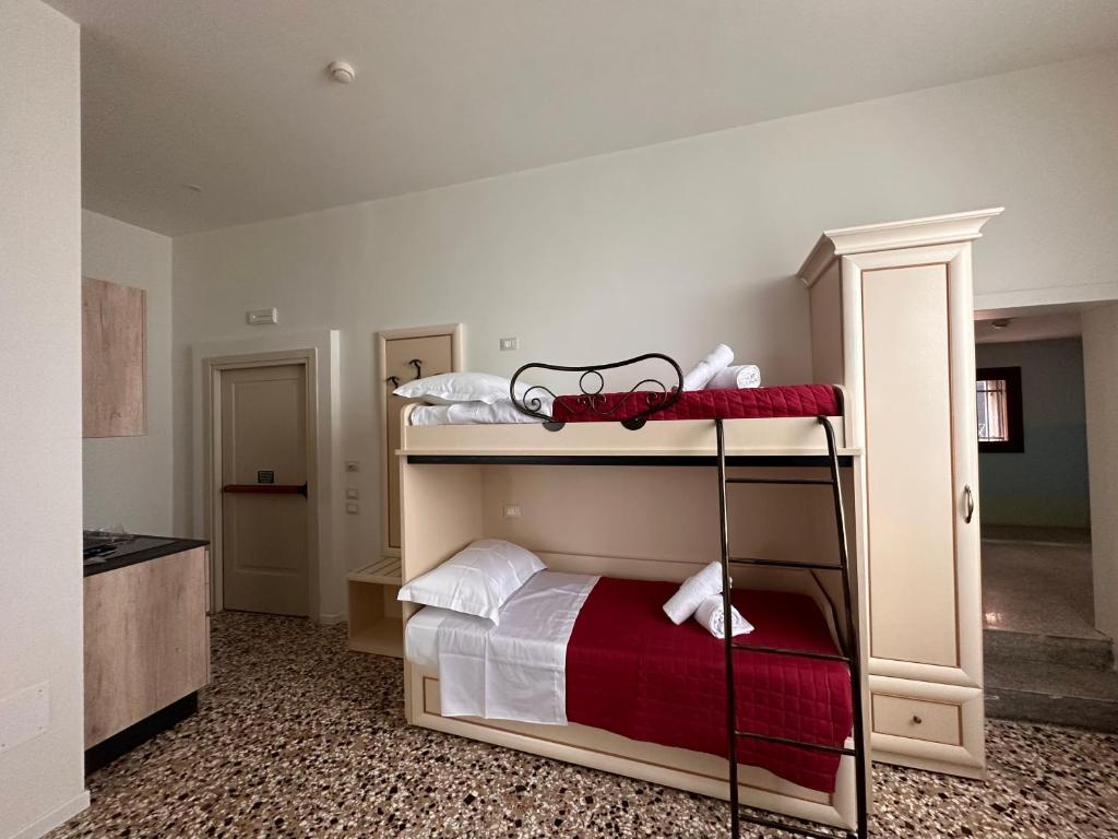 Postel nebo postele na pokoji v ubytování Collegio AMDG