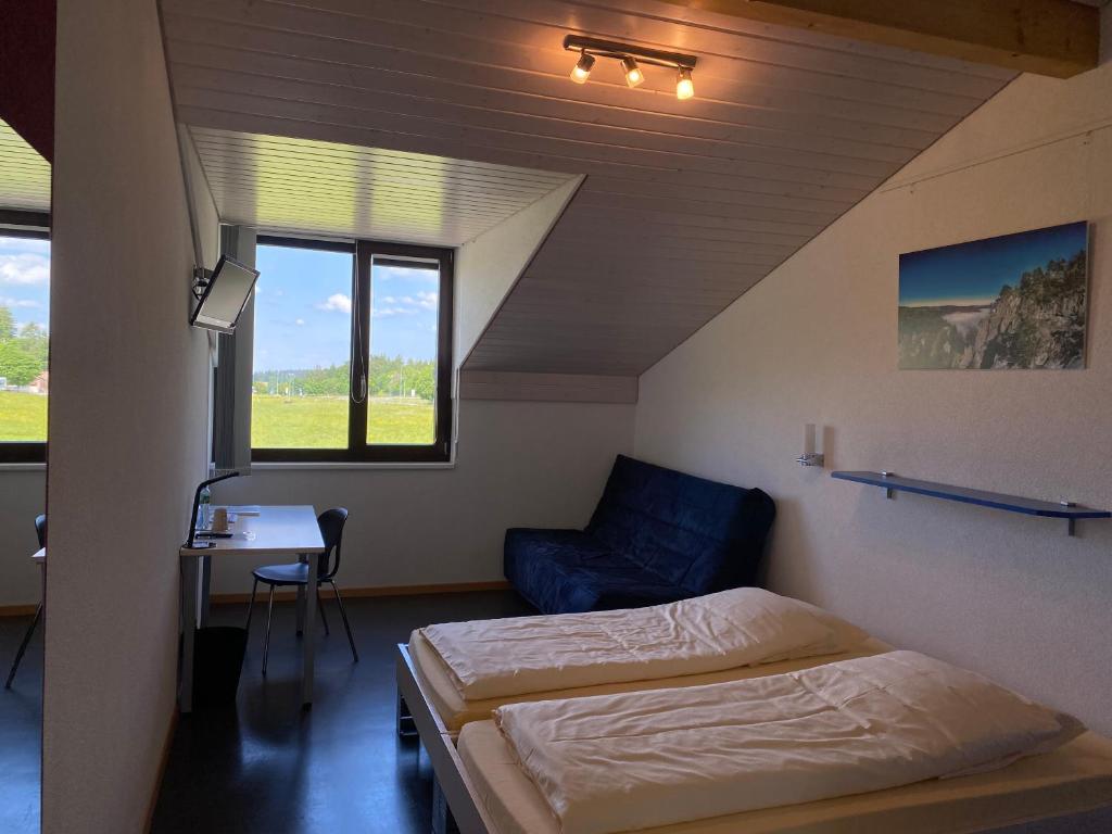 Postel nebo postele na pokoji v ubytování Jura Sport & Spa Resort
