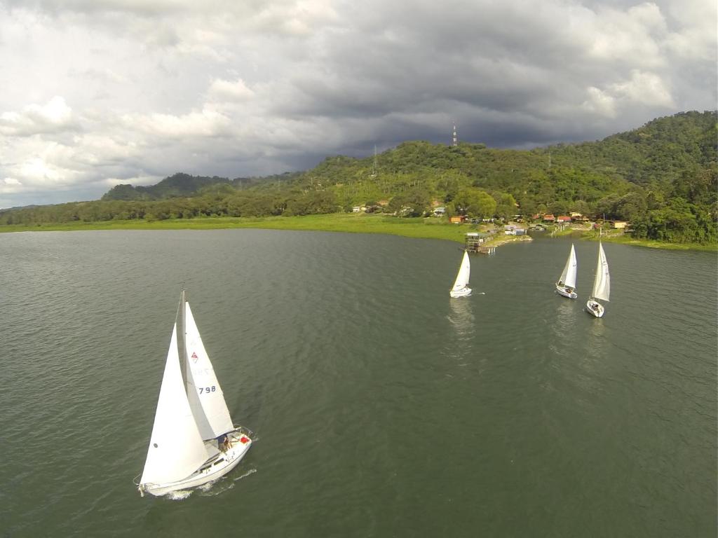 a group of sailboats in a body of water at Honduyate in Las Marías