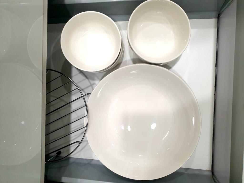 three white plates on a shelf with lights at Charming Studio 1BR 1LR Condo Georgetown 魅力一室一厅套房 in George Town