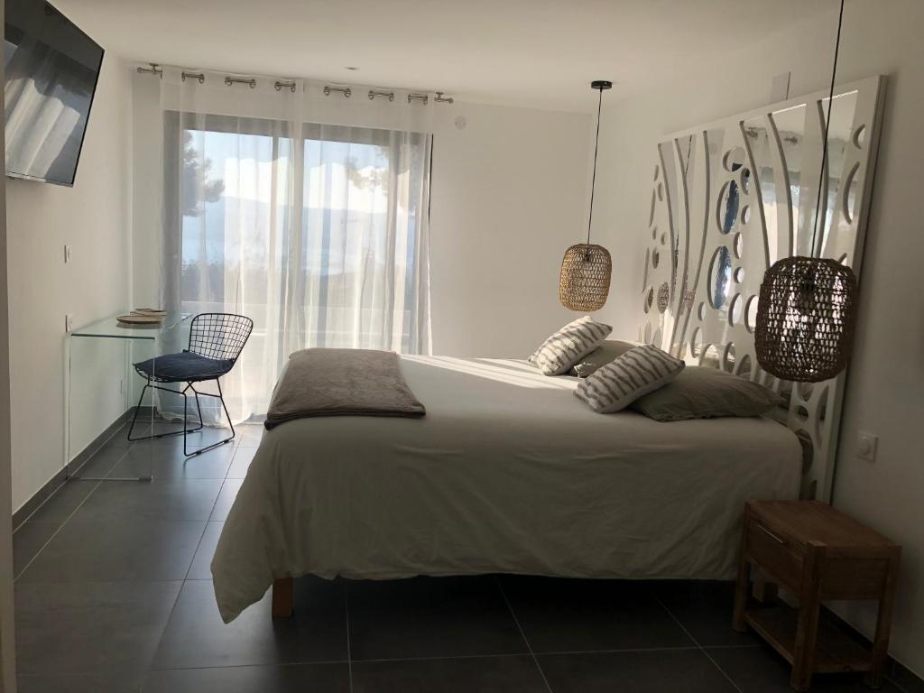 Postel nebo postele na pokoji v ubytování Escapade Martegale