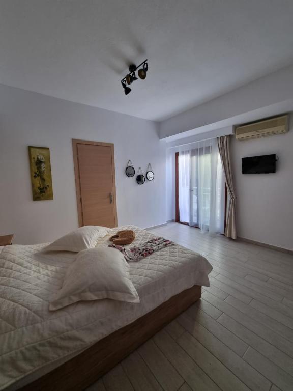 Postel nebo postele na pokoji v ubytování Bellos House