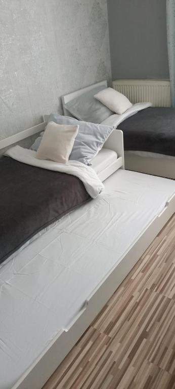 Posteľ alebo postele v izbe v ubytovaní Apartament Centrum